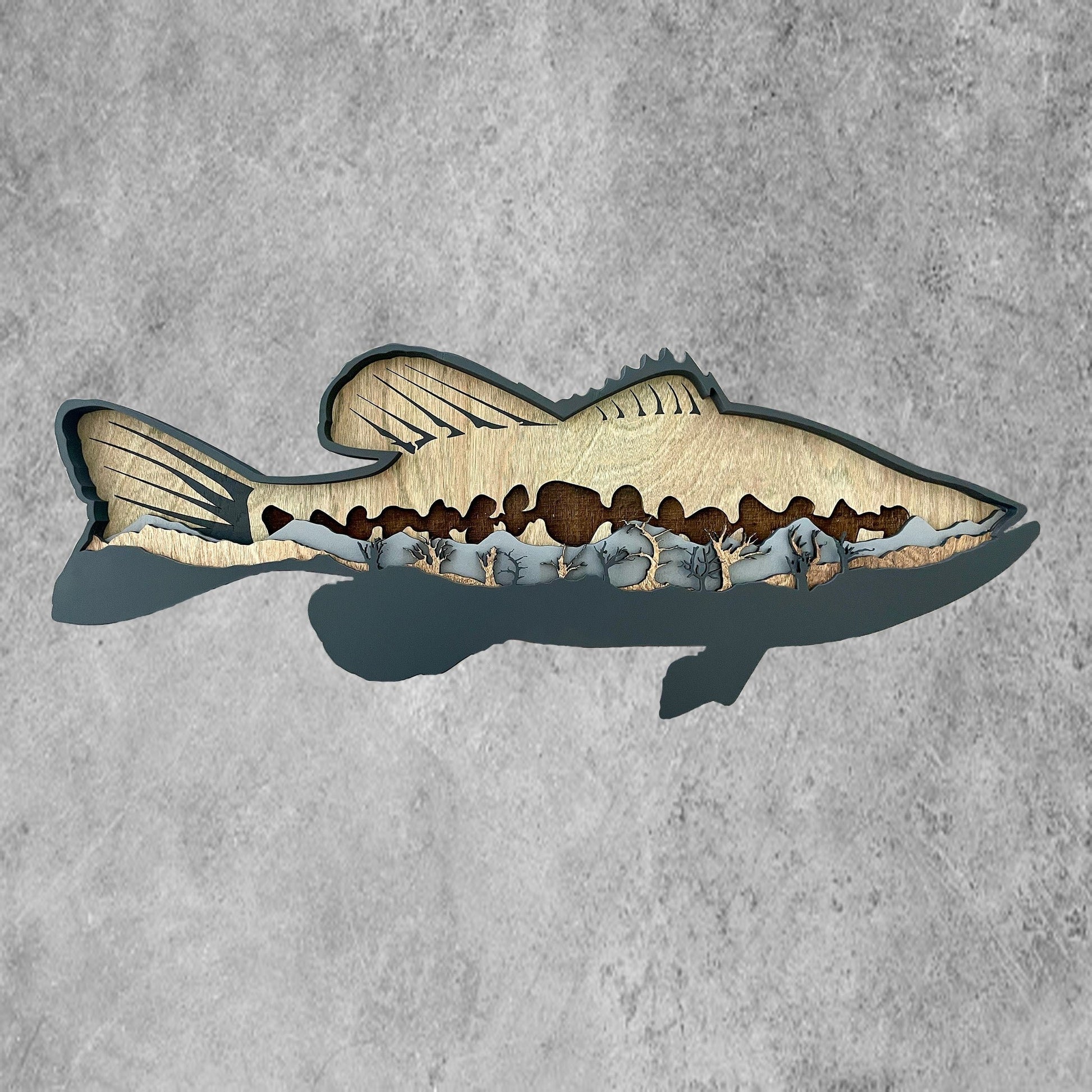 This bass design has an engraved back drop with painted back fins. Each layer is cut out, stained, and then assembled to form a very unique piece of art for any room in the house. 