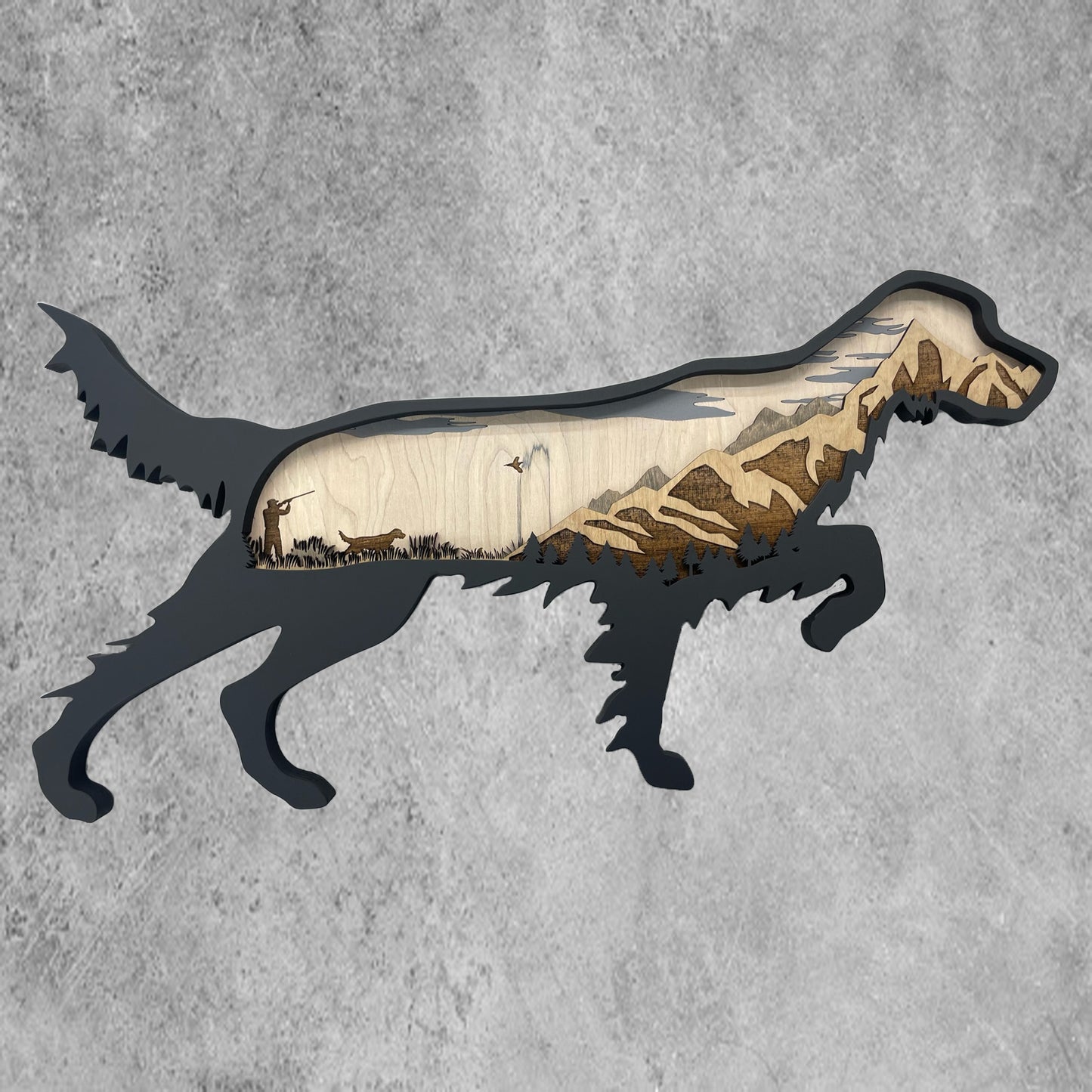 This four-layered English Setter design features a mountain backdrop with a pheasant hunting scene, including a setter that is frozen on point.